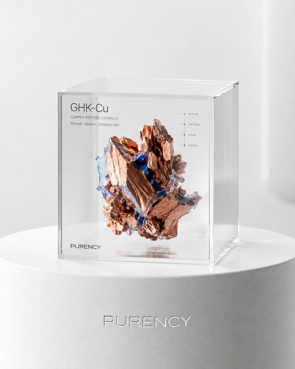 Mineral de cobre e GHK-Cu apresentados em um cubo de acrílico PURENCY